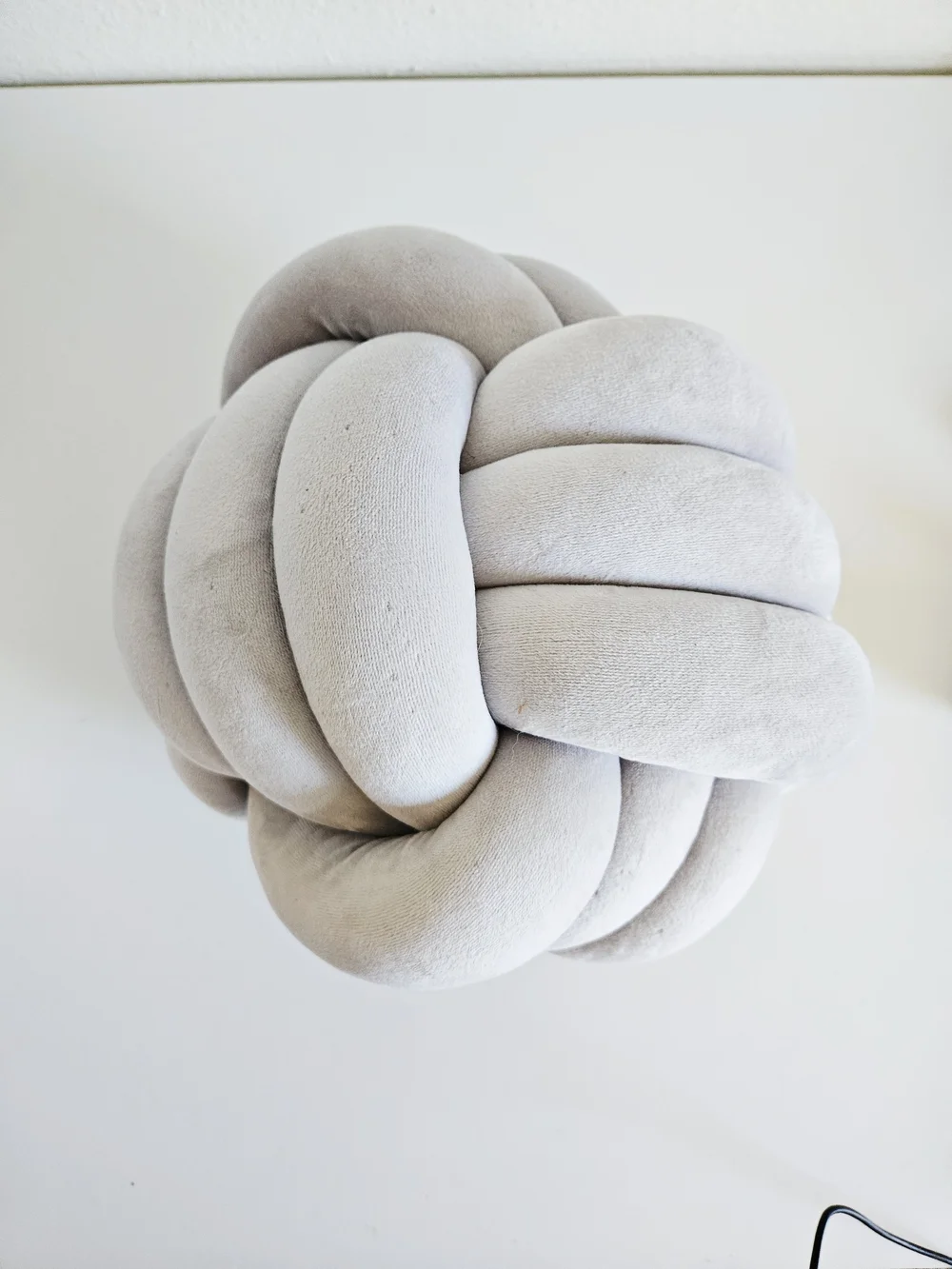 Plush Knot Throw Pillow in Light Gray